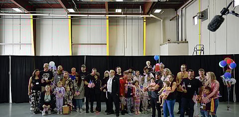 Newly arrived South Africans in a hangar at Atlantic Aviation Dulles near Washington Dulles International Airport.