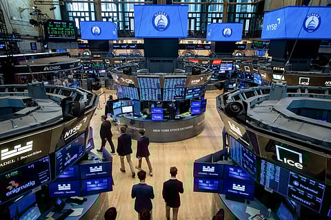 Traders work on the floor of the New York Stock Exchange.