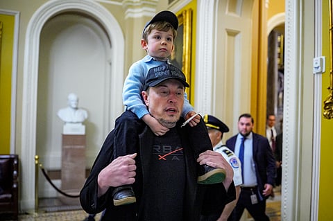 Elon Musk and his son X.