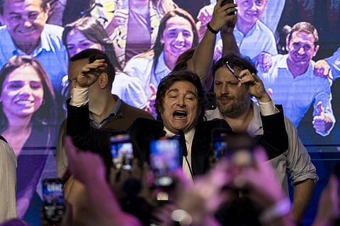 Javier Milei, Argentina's president, center, celebrates during a Libertad Avanza election night rally in Buenos Aires, Argentina, on Sunday, Oct. 26, 2025.