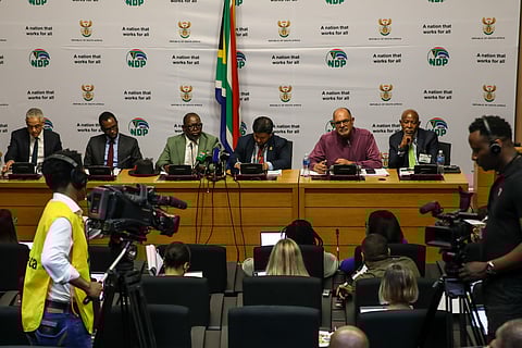 Duncan Pieterse, South Africa treasury director-general, David Masondo, South Africa's deputy finance minister, Enoch Godongwana, South Africa's finance minister, Ashor Sarupen, South Africa's second deputy finance minister, Edward Kieswetter, commissioner of the South African Revenue Service (SARS), and Lesetja Kganyago, governor of South Africa's Reserve Bank (SARB), left to right, at a news conference before the presentation of the medium-term budget update in Cape Town, South Africa, on Wednesday, Nov. 12, 2025.