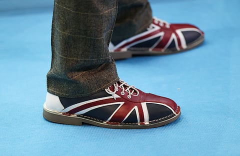 An man wearing British Union flag shoes