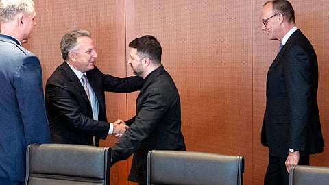 Friedrich Merz, right, Steve Witkoff, second left, and Volodymyr Zelenskiy in Berlin, in this photo released by the German Government Press Office, on Dec. 14.
