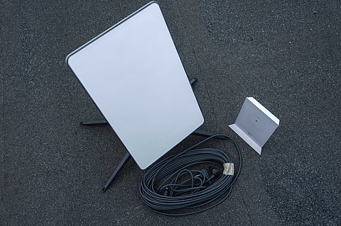 A Starlink satellite-internet communication system antenna and router.