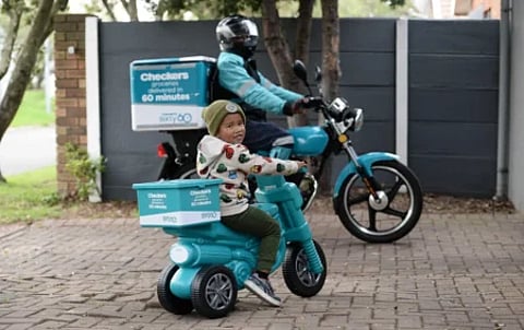 Image: Checkers has positioned gig work as a delivery driver as aspirational by selling plastic Sixty60 scooters for children.