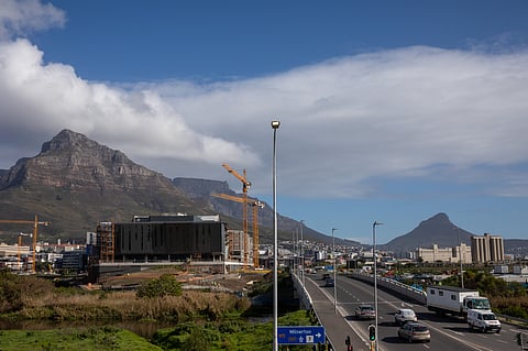 Traffic passes the Amazon.com Inc. Africa headquarters campus under construction near Table Mountain Riverlands development, in Cape Town.