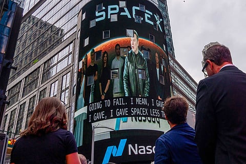 Elon Musk on screen during the SpaceX IPO.