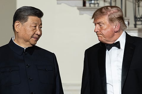 WASHINGTON, DC - SEPTEMBER 24: Chinese President Xi Jinping (L) looks to U.S. President Donald Trump as they descend the grand staircase before a state dinner in the East Room of the White House on September 24, 2026 in Washington, DC. Trump is hosting Xi for a three-day state visit to Washington, DC, where the leaders were expected to discuss trade practices, artificial intelligence and the furthering of "strategic stability" between the two countries. (Photo by Kevin Dietsch/Getty Images)