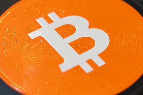 A Bitcoin logo on a magazine cover at the Bitcoin Asia conference in Hong Kong, China, on Thursday, Aug. 27, 2026. The conference runs through August 28. Photographer: Chan Long Hei/Bloomberg via Getty Images
