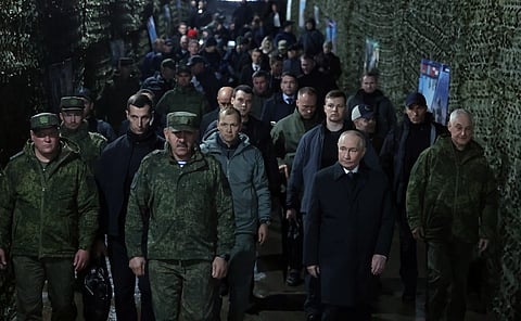 CHELYABINSK, RUSSIA - OCTOBER 2: Russian President Vladimir Putin attends the Center-2026 strategic command and staff exercise at the Chebarkul military training ground, while Russian Defense Minister Andrey Belousov, Deputy Defense Minister Yunus-Bek Yevkurov and Commander-in-Chief of the Russian Ground Forces Andrei Mordvichev brief him on the progress of the exercise, Chelyabinsk region of Russia, on October 2, 2026. (Photo by Kremlin Press Office / Handout/Anadolu via Getty Images)