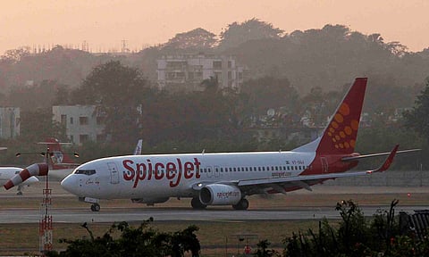 A SpiceJet Boeing 737-800 aircraft taxis on the tarmac after landing at Chhatrapati Shivaji international airport in Mumbai in this November 26, 2012 Reuters pic.