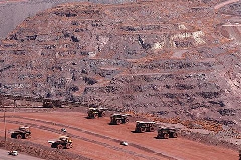 Haul trucks are seen at Kumba Iron Ore, the world's largest iron ore mines in Khathu, Northern Cape Province November 15, 2011. REUTERS/Siphiwe Sibeko