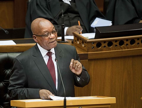 South Africa's President Jacob Zuma delivers his State of the Nation address at Parliament in Cape Town February 13, 2014. REUTERS/Roger Bosch/Pool