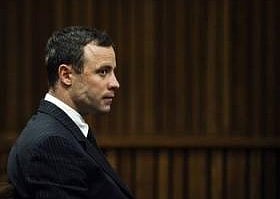 South African Olympic and Paralympic sprinter Oscar Pistorius sits in the dock during his trial in the North Gauteng High Court in Pretoria July 2, 2014. Pistorius is on trial for murdering his girlfriend Reeva Steenkamp at his suburban Pretoria home on Valentine's Day last year. REUTERS/Gianluigi Guercia/Pool
