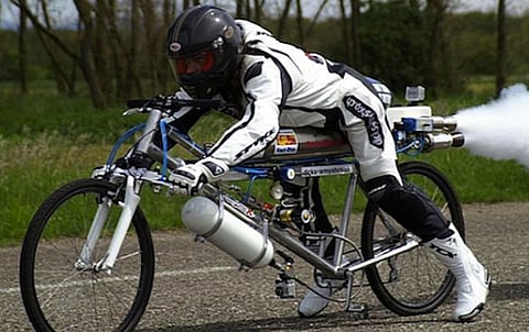 WATCH: Frenchman on a bicycle vs Ferrari F430