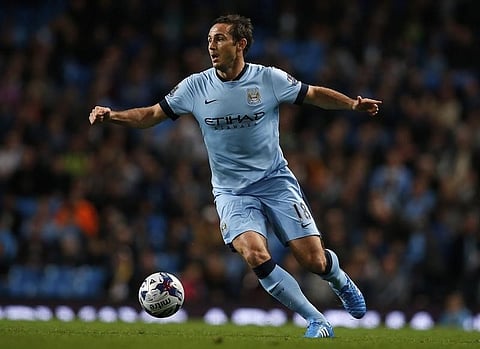 Manchester City's Frank Lampard runs with the ball during their League Cup soccer match against Sheffield Wednesday at Etihad Stadium in Manchester, northern England September 24, 2014. REUTERS/Andrew Yates