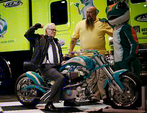 Billionaire financier and Berkshire Hathaway Chief Executive Warren Buffett poses on a motorcycle during the Berkshire Hathaway Annual Shareholders meeting in Omaha, Nebraska in this May 3, 2008 file photo. Berkshire Hathaway Inc agreed to take over unlisted German motorbike accessories retailer Detlev Louis Motorrad-Vertriebs GmbH, the seller's law first said February 20, 2015. REUTERS/Carlos Barria/files (UNITED STATES - Tags: BUSINESS PROFILE)