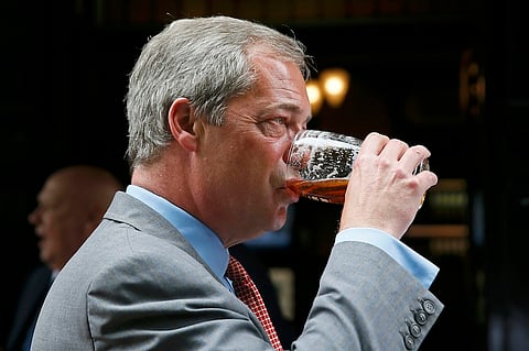 Leader of the United Kingdom Independence Party (UKIP) Nigel Farage enjoys a pint of beer in central London, Britain June 17, 2015. Farage was holding an event to unveil a new pamphlet on the European Union. REUTERS/Stefan Wermuth