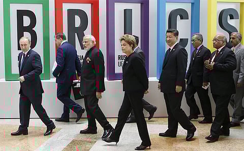 Russian President Vladimir Putin (L),  Indian Prime Minister Narendra Modi (3rd L), Brazil's President Dilma Rousseff (C), Chinese President Xi Jinping (4th R) and South African President Jacob Zuma (2nd R) walk after the welcoming ceremony during the BRICS Summit in Ufa, Russia, July 9, 2015. Ufa is hosting the BRICS and the Shanghai Cooperation Organization (SCO) summits from July 9-10. REUTERS/Sergei Karpukhin