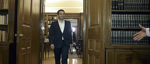 Updated with video: Greece Parliament accepts new, harsher terms of EU bailout