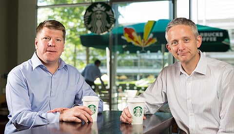 Starbucks announces an exclusive licensed partnership with Taste Holdings for the opening of stores in South Africa, the first in sub-Saharan Africa. Pictured above (from left to right) are Kris Engskov, president, Starbucks Europe, the Middle East and Africa (EMEA) and Carlo Gonzaga, CEO of Taste Holdings. Credit: David Parry