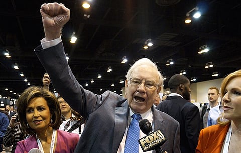 Berkshire Hathaway CEO Warren Buffett yells "Go big red!", the Nebraska Cornhuskers chant, prior to the Berkshire annual meeting in Omaha, Nebraska, in this file photo taken May 2, 2015. Berkshire Hathaway Inc said August 7, 2015 its second-quarter profit fell 37 percent, reflecting a significant decline in investment gains and an underwriting loss from insurance. REUTERS/Rick Wilking/Files