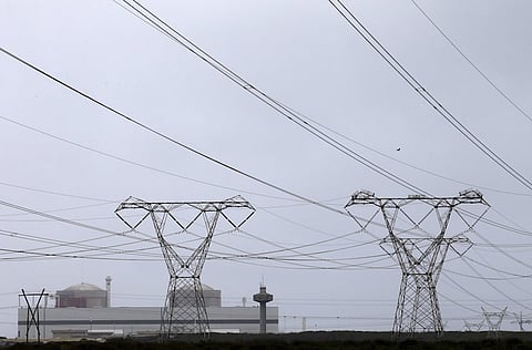 Pylons carry power from South Africa's Koeberg nuclear power plant near Cape Town August 13, 2015. Fears are growing in South Africa that agreements to build nuclear power plants that could be the most expensive procurement in the country's history will be made behind closed doors, without the necessary public scrutiny. Construction on the first plant is due to start next year, breakneck speed compared with the years of regulatory and environmental checks for nuclear projects in countries such as Britain and the United States. Picture taken August 13, 2015.  REUTERS/Mike Hutchings