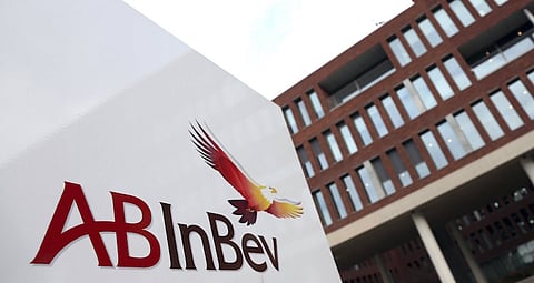 The Anheuser-Busch InBev logo is seen outside the brewer's headquarters in Leuven, Belgium in this February 26, 2014 file photo. Anheuser-Busch InBev has approached rival SABMiller about a takeover that would form a brewing colossus which makes around a third of the beer consumed globally. Belgium's AB InBev - the world's biggest brewer - makes Budweiser, Stella Artois and Corona, while Britain-based SABMiller - the No. 2 player - owns Peroni, Grolsch and Pilsner Urquell beers.     REUTERS/Francois Lenoir/Files