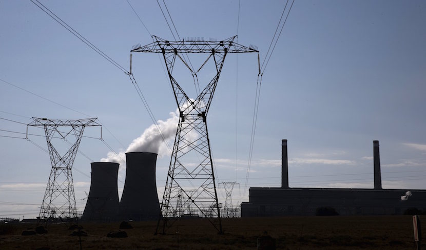 Electricity pylons are seen near Arnot Power Station's cooling towers, east of Middelburg in Mpumalanga province, September 8 2015. REUTERS/Siphiwe Sibeko