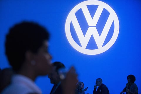 Attendees take part in the 2016 Volkswagen Passat reveal in the Brooklyn borough of New York September 21, 2015. Volkswagen AG's U.S. head on Monday said he was confident the German automaker would restore customer confidence after it "totally screwed up" by rigging emissions tests of diesel-powered vehicles in the United States. Michael Horn vowed to make amends at a lavish event in New York to promote the 2016 Passat where the carmaker doled out German beer, pretzels and "cheddary ale fondue" to dealers and the media, before a performance of rockstar Lenny Kravitz. REUTERS/Darren Ornitz