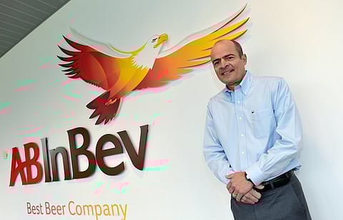 Carlos Brito, chief executive of Anheuser-Busch InBev, poses for photographer prior to a news conference in Leuven in this file photo from February 26, 2015. Anheuser-Busch InBev has approached rival SABMiller about a takeover that would form a brewing colossus which makes around a third of the beer consumed globally. REUTERS/Eric Vidal/Files