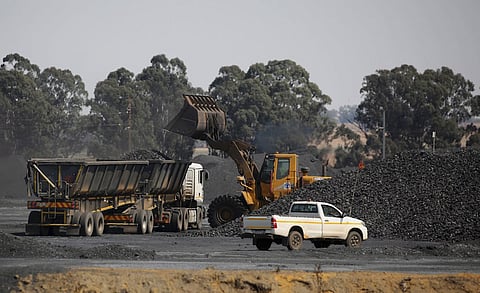 Coal is loaded onto a truck at the Woestalleen colliery near Middleburg in Mpumalanga province, in this September 8, 2015 file photo. REUTERS/Siphiwe Sibeko/Files