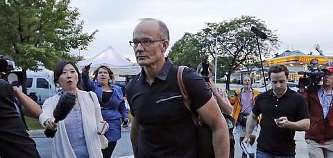 Walter Palmer arrives at the River Bluff Dental clinic in Bloomington, Minnesota, in this September 8, 2015, file photo. Zimbabwe will not charge American dentist Walter Palmer for killing its most prized lion in July because he had obtained legal authority to conduct the hunt, a cabinet minister said, October 12, 2015. REUTERS/Eric Miller/Files