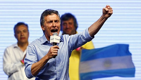 Mauricio Macri, presidential candidate of the Cambiemos (Let's Change) coalition, gestures to his supporters after the presidential election in Buenos Aires, Argentina, November 22, 2015. Conservative opposition candidate Macri comfortably won Argentina's presidential election on Sunday after promising business-friendly reforms to spur investment in the struggling economy. REUTERS/Ivan Alvarado TPX IMAGES OF THE DAY