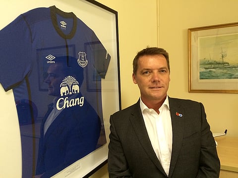 Ian Kilbride in the Warwick boardroom - shopwing off one of his prize possessions: an Everton FC shirt.