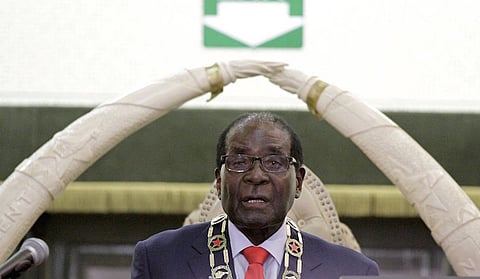 Zimbabwe's President Robert Mugabe delivers his state of the nation address to the country's parliament in Harare, August 25, 2015. Mugabe pinned his hopes on China helping to revive Zimbabwe's struggling economy on Tuesday and outlined reforms to investment rules to try to attract more capital. In his first state of the nation address in eight years, the 91-year-old president, who has presided over economic collapse and diplomatic isolation since he came to power in 1980, said strong growth was just around the corner. REUTERS/Philimon Bulawayo