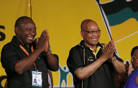South Africa's President Jacob Zuma (C) alongside his deputy Cyril Ramaphosa (L). REUTERS/Mike Hutchings/Files