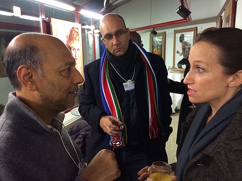 World renown film maker Anant Singh (left) in conversation with an admirer at the World Economic Forum in Davos.