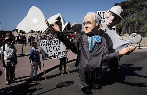 Giant puppets representing Australian Prime Minister Malcolm Turnbull (L) and his predecessor Tony Abbott parade in front of the Sydney Opera House during a rally held ahead of the 2015 Paris Climate Change Conference, known as the COP21 summit, in Sydney's central business district, Australia. REUTERS/Jason Reed