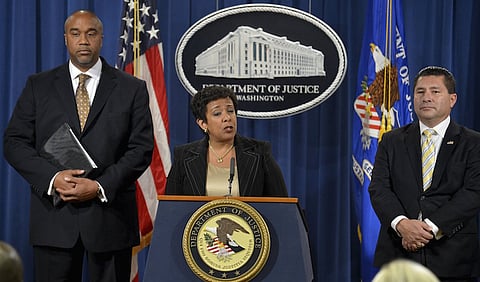 U.S. Attorney General Loretta Lynch (C) makes remarks at a news conference to announce a law enforcement action relating to FIFA, as U.S. Attorney for the Eastern District of New York Robert Capers (L) and FBI Assistant Director New York Field Office Diego Rodriguez listen, in Washington, December 3, 2015. Officials Alfredo Hawit and Juan Angel Napout have been arrested by Swiss authorities in the ongoing soccer scandal.   REUTERS/Mike Theiler