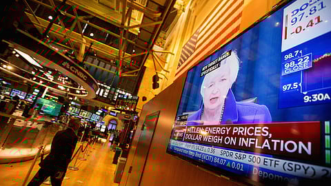 Traders work as Janet Yellen, chair of the U.S. Federal Reserve, is seen speaking on a television screen on the floor of the New York Stock Exchange (NYSE) in New York, U.S., on Wednesday, Dec. 16, 2015. The Federal Reserve raised interest rates for the first time in almost a decade in a widely telegraphed move while signaling that the pace of subsequent increases will be "gradual" and in line with previous projections. Photographer: Michael Nagle/Bloomberg