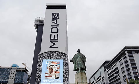 An advertisment for Golf Digest magazine sits on display beside a statue of explorer Bartolomeu Dias outside the offices of the Media24 Ltd. media group, operated by Naspers Ltd., at the company's headquarters in Cape Town, South Africa. Naspers, a key investor in ChinaÕs Tencent and Russia's Mail.ru, is now targeting investments in the United States. Photographer: Graeme Williams/Bloomberg