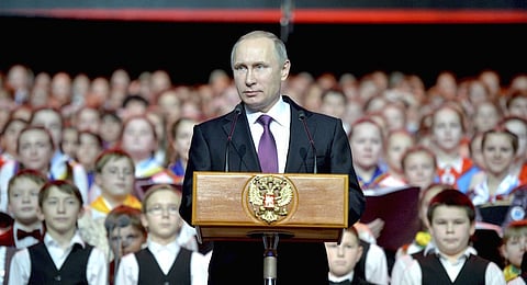 President Vladimir Putin delivers a speech during a concert of the Children's Choir of Russia in Moscow, Russia, December 25, 2015. Picture taken December 25, 2015. REUTERS/Alexei Druzhinin/Sputnik/Kremlin