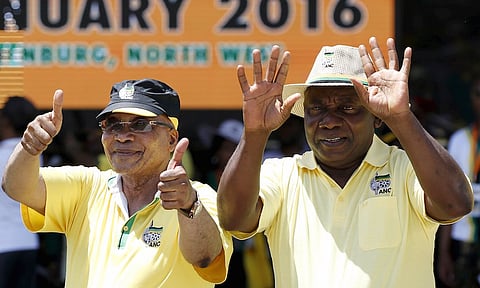 South Africa's President Jacob Zuma (L), who is also the president of the ruling party, the African National Congress (ANC), gestures next to his Deputy President Cyril Ramaphosa during the party's 104th anniversary celebrations in Rustenburg January 9, 2016. REUTERS/Siphiwe Sibeko
