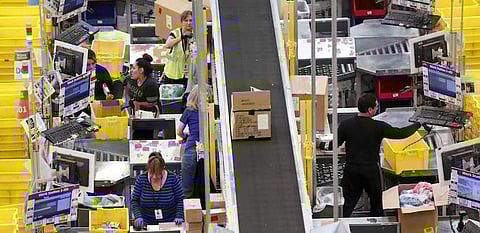 Workers prepare orders for customers at the Amazon Fulfillment Center in Tracy, California, in this file photo. REUTERS/Fred Greaves/Files