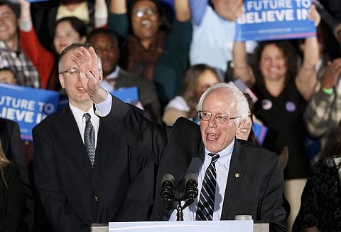 U.S. Democratic presidential candidate Bernie Sanders smiles after winning at his 2016 New Hampshire presidential primary night rally in Concord, New Hampshire February 9, 2016. REUTERS/Rick Wilking