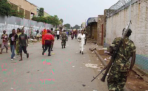 A soldier patrols the streets after a grenade attack of Burundi's capital Bujumbura, February 3, 2016. At least one person was killed in a grenade attack on a bar in Burundi on Monday night, witnesses said, in more violence since the African Union backed away from sending in peacekeepers without the government's consent. REUTERS/Jean Pierre Aime Harerimama
