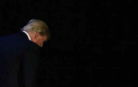 Republican U.S. presidential candidate Donald Trump leaves the stage at his caucus night rally in Des Moines, Iowa February 1, 2016. REUTERS/Carlos Barria
