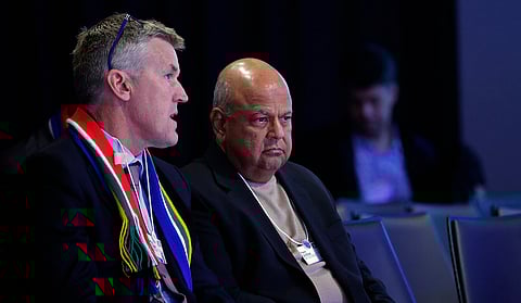 Stephen Van Coller, chief executive officer of corporate and investment banking at Barclays Africa Group Ltd., left, and Pravin Gordhan, South Africa's finance minister, attend a panel session at the World Economic Forum (WEF) in Davos, Switzerland, 2016. Photographer: Matthew Lloyd/Bloomberg