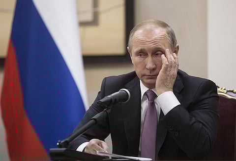 Vladimir Putin, Russia's president, pauses during a news conference alongside Hassan Rouhani, Iran's president, not pictured, at the Gas Exporting Countries Forum (GECF) summit in Tehran, Iran, 2015. The talks between Putin, on his first visit to Iran since 2007, and Iran's Supreme Leader Ayatollah Ali Khamenei focused on the situation in Syria, where both Russia and Iran back Syrian President Bashar al-Assad, as well as the wider region. Photographer: Simon Dawson/Bloomberg
